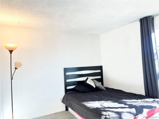 17413 E Louisiana Ave, Aurora, CO 80017 - carpeted bedroom featuring a textured ceiling