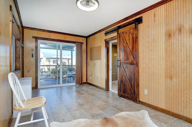 10795 County Road 197a Unit 6, Nathrop, CO 81236 - spare room with a barn door, crown molding, and wood walls