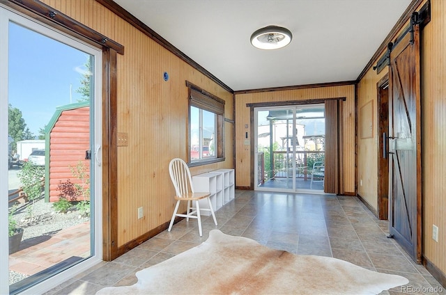10795 County Road 197a Unit 6, Nathrop, CO 81236 - doorway featuring crown molding, a barn door, wooden walls, and light tile patterned floors