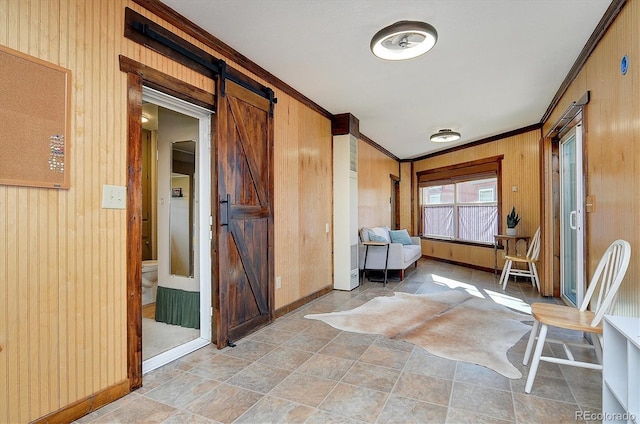 10795 County Road 197a Unit 6, Nathrop, CO 81236 - interior space with a barn door, wooden walls, and ornamental molding