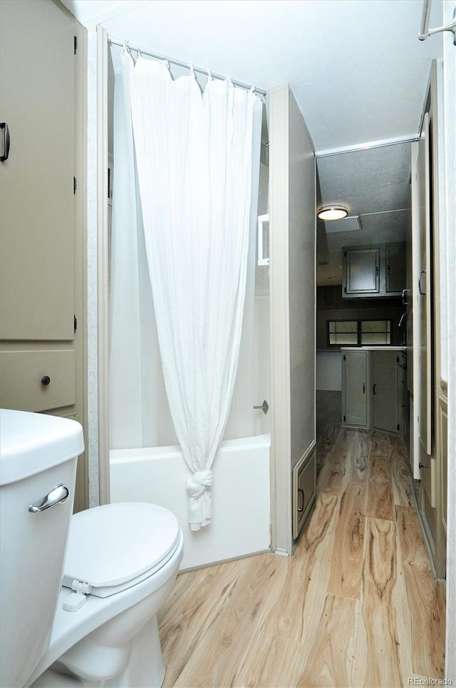10795 County Road 197a Unit 6, Nathrop, CO 81236 - full bathroom featuring wood finished floors and shower / bath combination with curtain