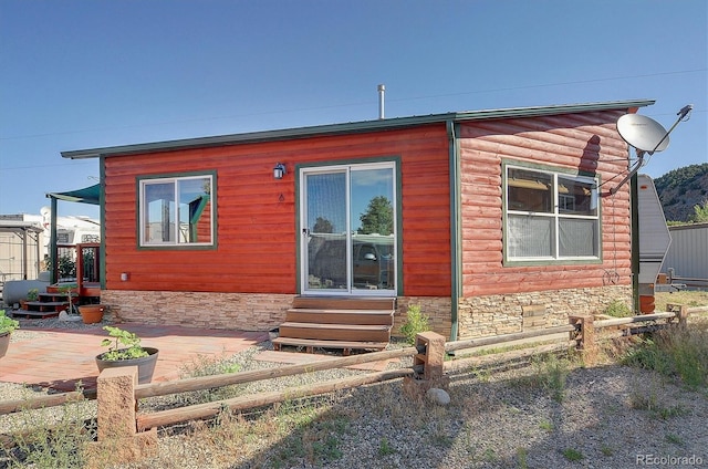 10795 County Road 197a Unit 6, Nathrop, CO 81236 - back of house featuring entry steps and stone siding