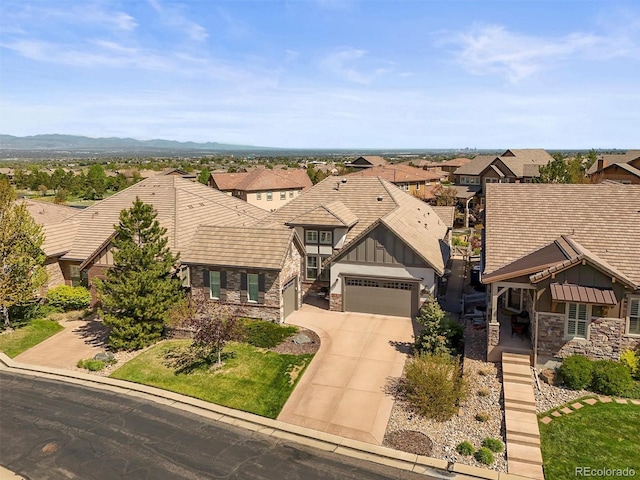 10687 Featherwalk Way, Highlands Ranch, CO 80126 - view of front of home featuring stone siding, driveway, board and batten siding, and a residential view