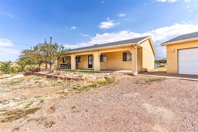 ranch-style home featuring a porch