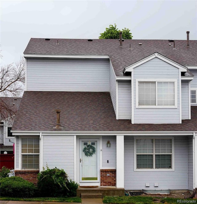 12242 Bannock Cir Unit D, Denver, CO 80234 - view of front of home with roof with shingles and brick siding