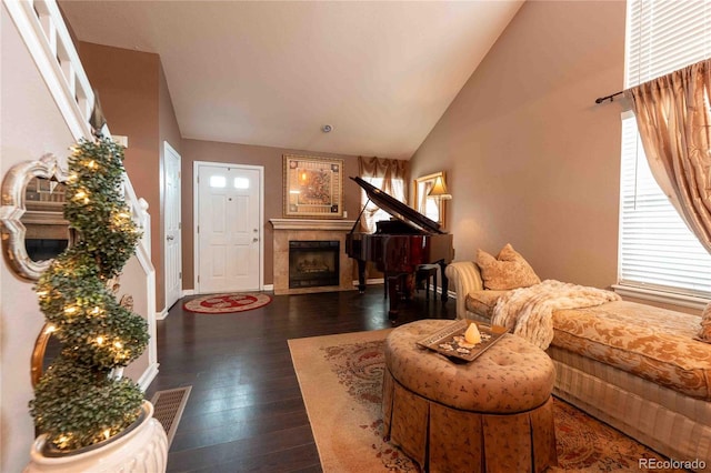 12242 Bannock Cir Unit D, Denver, CO 80234 - living area with lofted ceiling, dark wood finished floors, a fireplace with flush hearth, healthy amount of natural light, and baseboards