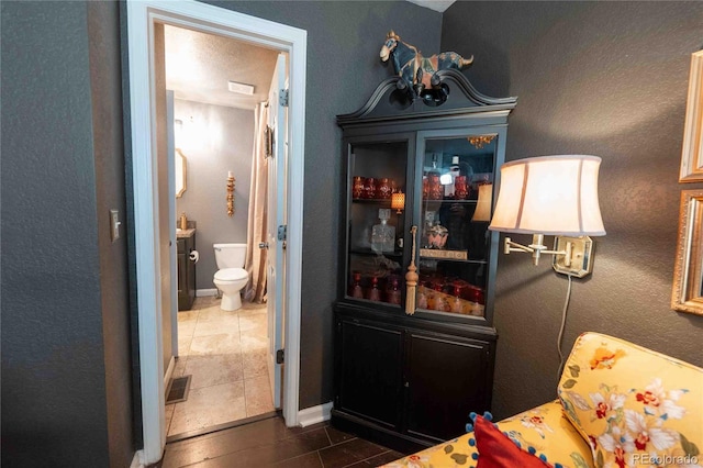 12242 Bannock Cir Unit D, Denver, CO 80234 - bar featuring dark tile patterned floors and baseboards