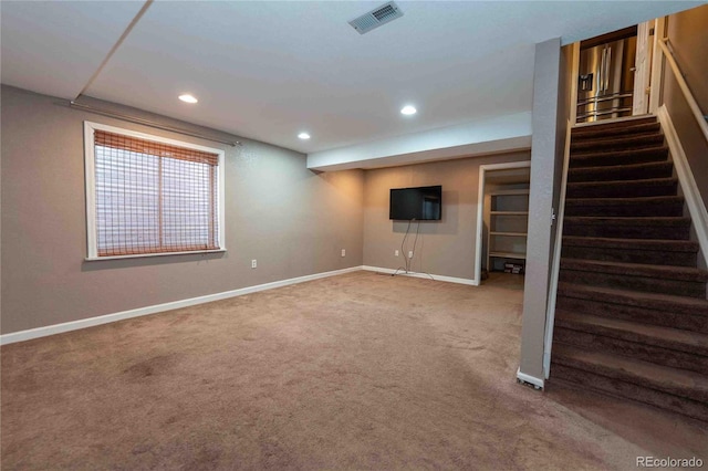 12242 Bannock Cir Unit D, Denver, CO 80234 - basement with carpet floors, baseboards, stairway, and recessed lighting