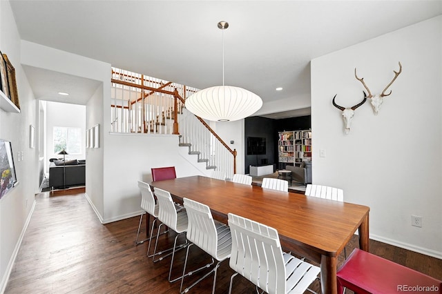 11985 Singing Winds St, Parker, CO 80138 - dining space featuring stairs, wood finished floors, baseboards, and recessed lighting