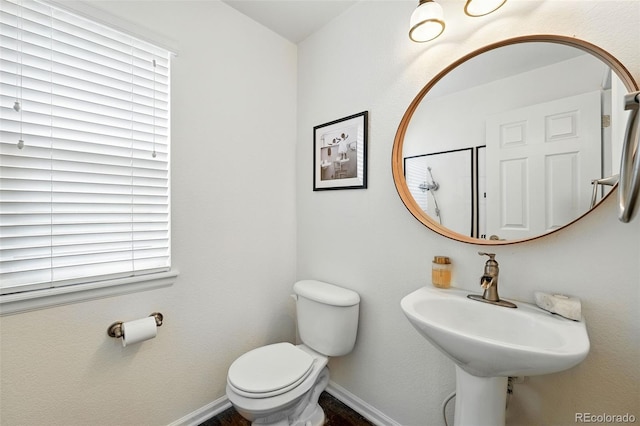 11985 Singing Winds St, Parker, CO 80138 - bathroom with baseboards and toilet