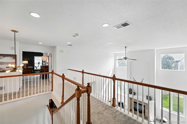 11985 Singing Winds St, Parker, CO 80138 - corridor featuring carpet floors, recessed lighting, and an upstairs landing