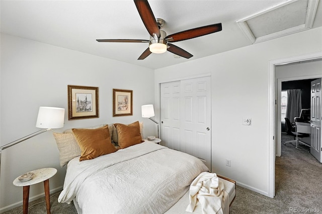 11985 Singing Winds St, Parker, CO 80138 - carpeted bedroom with a closet, attic access, baseboards, and ceiling fan