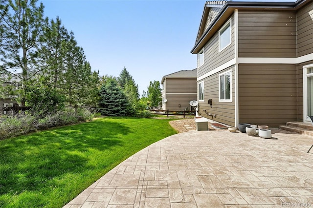 11985 Singing Winds St, Parker, CO 80138 - view of grassy yard featuring a patio