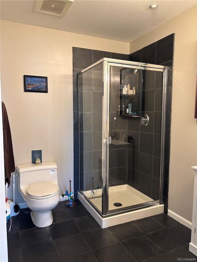 full bathroom with visible vents, toilet, a shower stall, tile patterned flooring, and baseboards