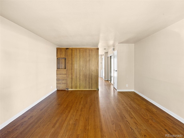 61 S Sable Blvd Unit C15, Aurora, CO 80012 - unfurnished room featuring dark wood-style flooring and baseboards