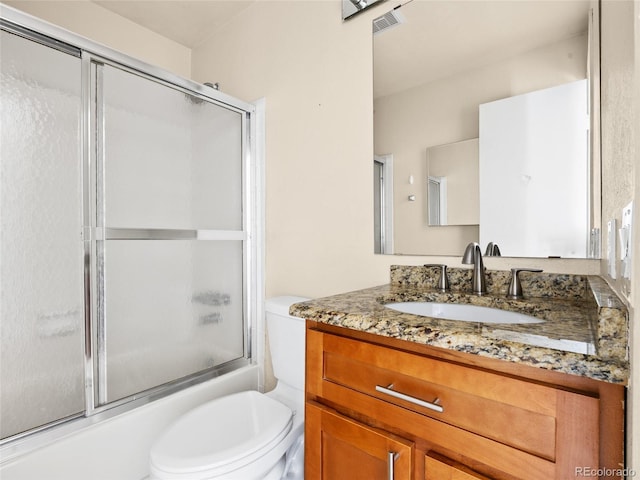61 S Sable Blvd Unit C15, Aurora, CO 80012 - bathroom with toilet, bath / shower combo with glass door, and vanity