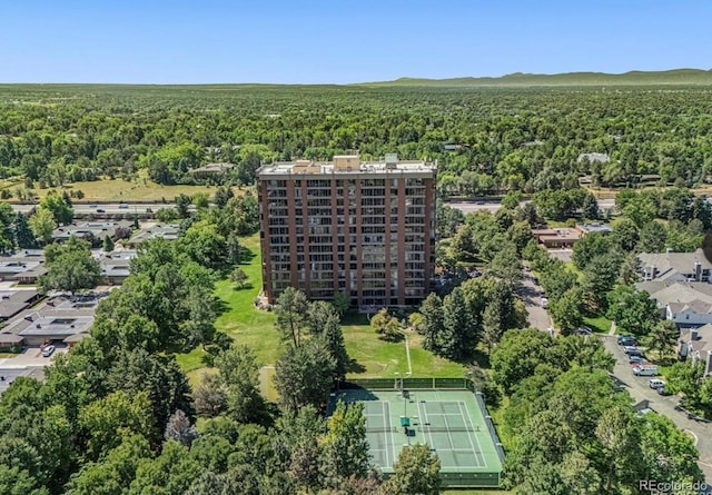 aerial view featuring a wooded view