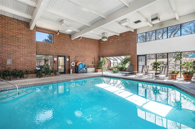 indoor pool featuring a patio