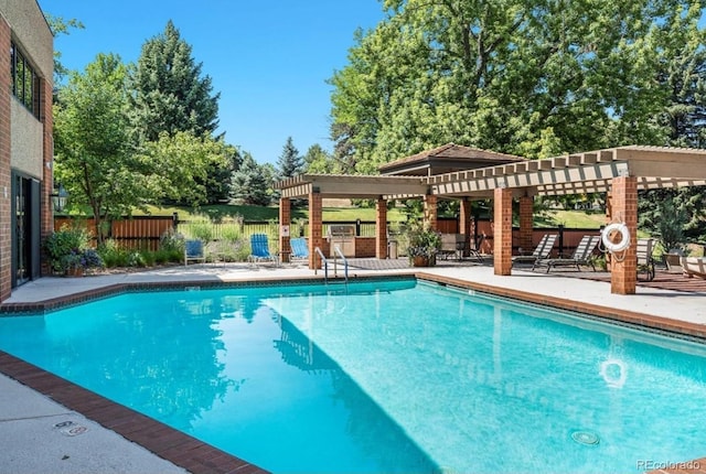 community pool with fence, a pergola, and a patio