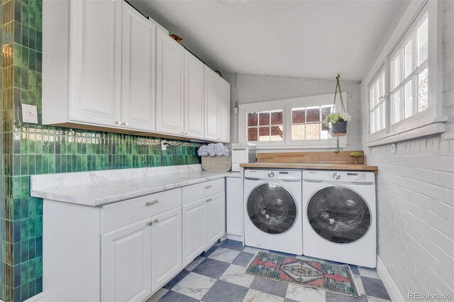 748 Elati St, Denver, CO 80204 - laundry room featuring washing machine and dryer and cabinet space