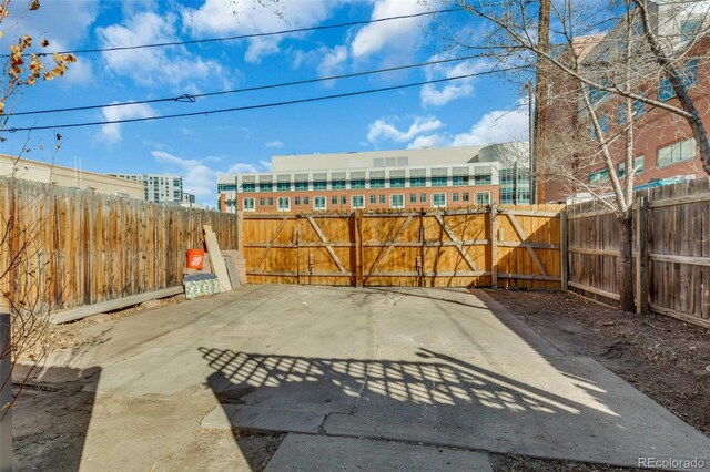 748 Elati St, Denver, CO 80204 - view of patio featuring a gate