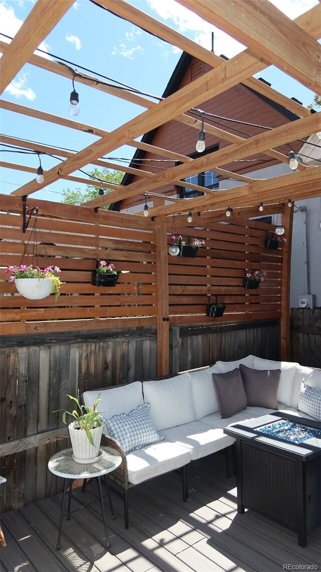 748 Elati St, Denver, CO 80204 - wooden terrace with an outdoor living space with a fire pit