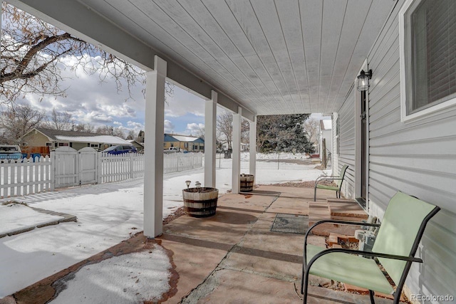 view of snow covered patio