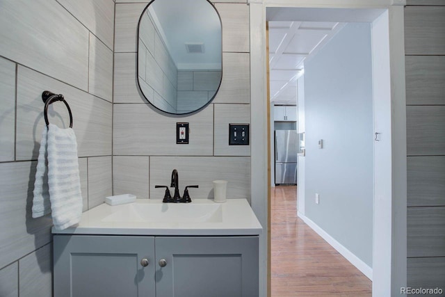 bathroom with hardwood / wood-style flooring and vanity