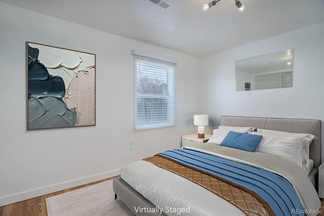 bedroom featuring hardwood / wood-style floors