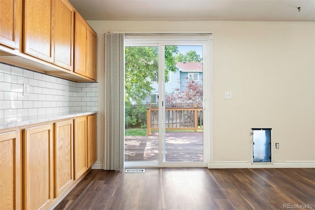 3461 Maple Cir, Brighton, CO 80601 - entryway with dark wood-style floors and baseboards
