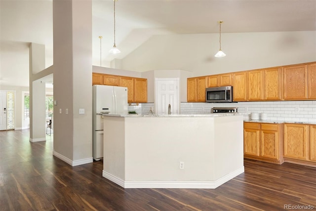 3461 Maple Cir, Brighton, CO 80601 - kitchen featuring stainless steel microwave, white fridge with ice dispenser, high vaulted ceiling, decorative backsplash, and dark wood-type flooring