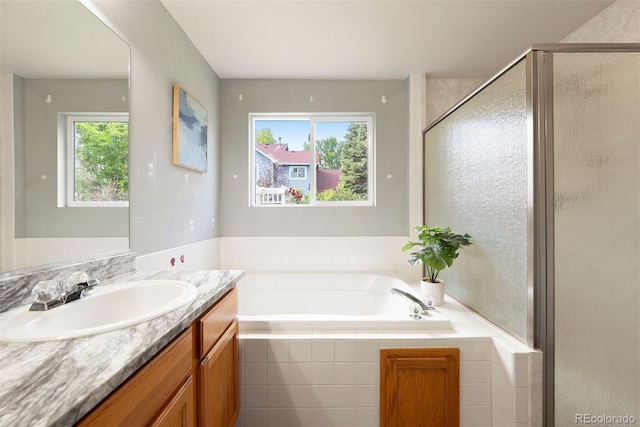 3461 Maple Cir, Brighton, CO 80601 - bathroom featuring a shower stall, vanity, and a garden tub