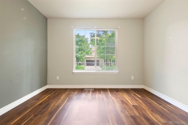 3461 Maple Cir, Brighton, CO 80601 - unfurnished room featuring dark wood-type flooring and baseboards