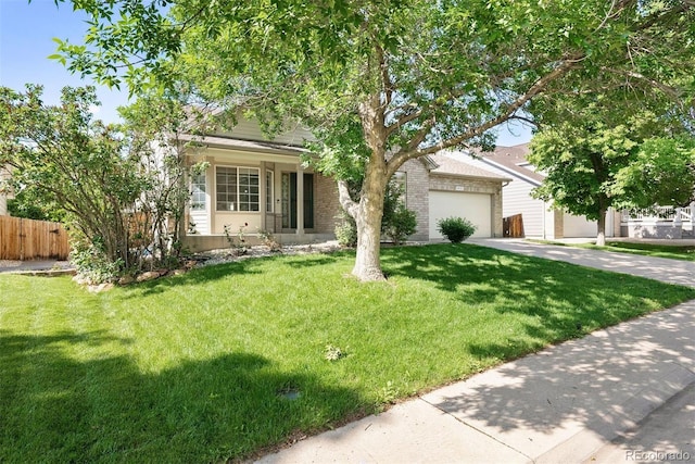 3461 Maple Cir, Brighton, CO 80601 - obstructed view of property with driveway, brick siding, and a garage