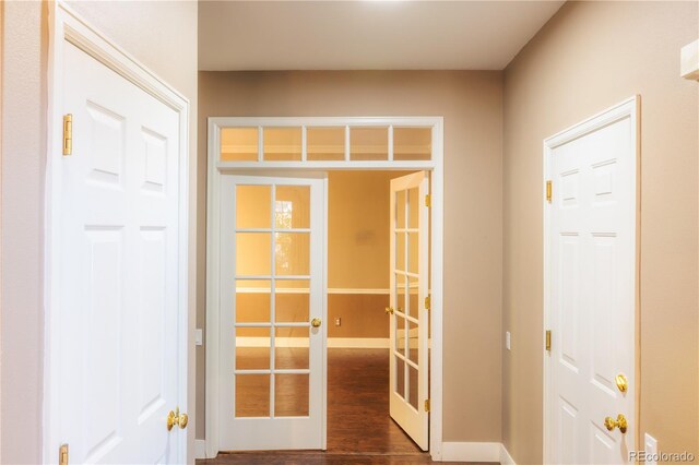 entryway featuring dark hardwood / wood-style floors and french doors