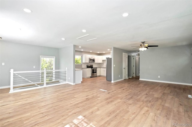 1210 Westend Ave, Colorado Springs, CO 80904 - unfurnished living room with recessed lighting, light wood-style flooring, ceiling fan, and attic access