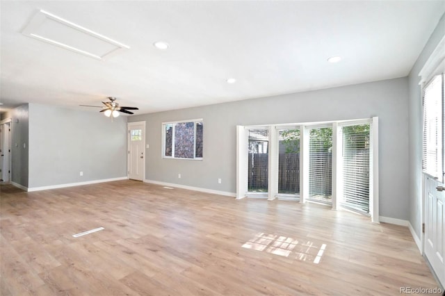 1210 Westend Ave, Colorado Springs, CO 80904 - unfurnished living room featuring healthy amount of natural light, attic access, light wood-style flooring, and recessed lighting