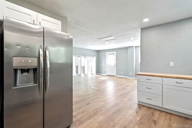 1210 Westend Ave, Colorado Springs, CO 80904 - kitchen with stainless steel refrigerator with ice dispenser, butcher block countertops, open floor plan, light wood-style floors, and recessed lighting