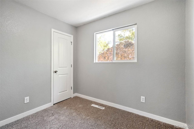 1210 Westend Ave, Colorado Springs, CO 80904 - spare room featuring carpet floors and baseboards