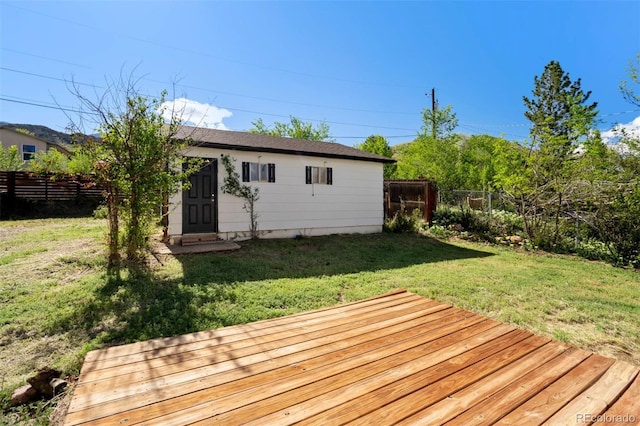 1210 Westend Ave, Colorado Springs, CO 80904 - wooden terrace featuring a fenced backyard and an outdoor structure