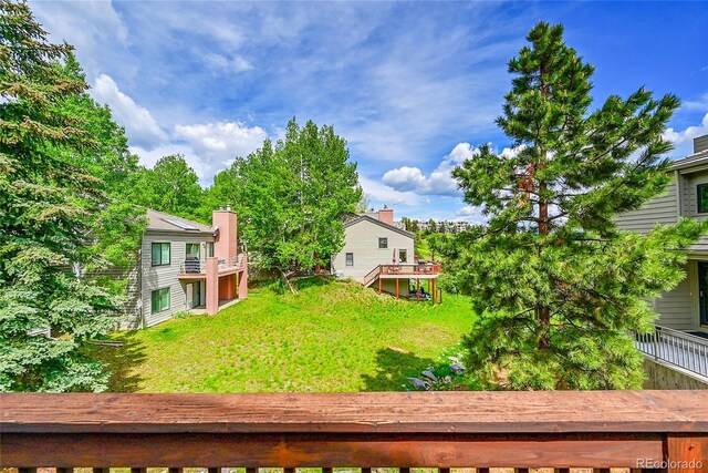 766 Chimney Creek Dr, Golden, CO 80401 - view of green lawn with a wooden deck