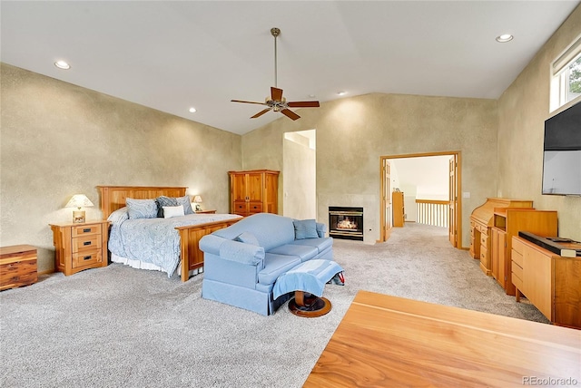766 Chimney Creek Dr, Golden, CO 80401 - bedroom featuring light colored carpet, recessed lighting, a tiled fireplace, vaulted ceiling, and a ceiling fan