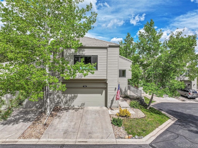 766 Chimney Creek Dr, Golden, CO 80401 - traditional home featuring a garage, concrete driveway, and a tiled roof