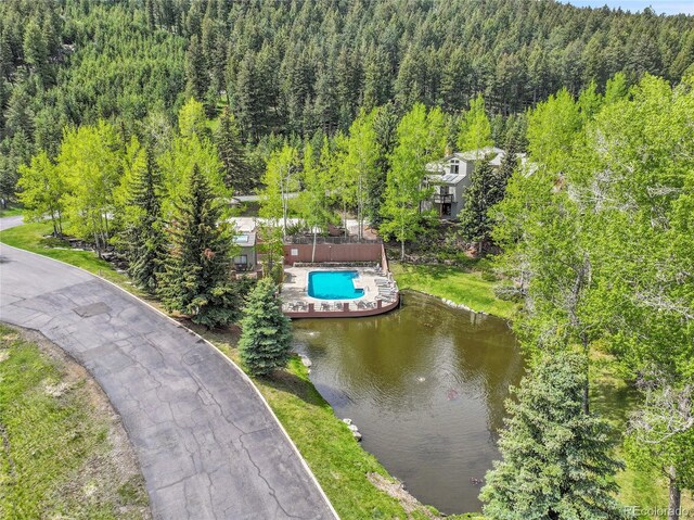 766 Chimney Creek Dr, Golden, CO 80401 - aerial view of a heavily wooded area, a pool area, and a large body of water