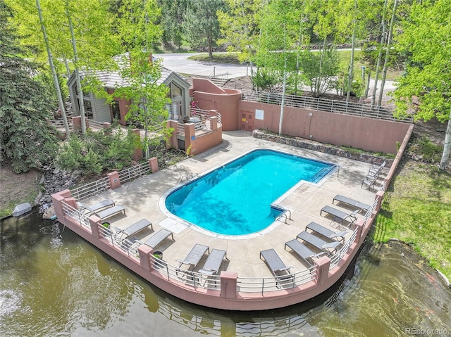 766 Chimney Creek Dr, Golden, CO 80401 - view of swimming pool featuring a water view and a patio