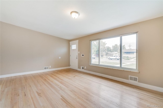 3216 Revere St, Aurora, CO 80011 - empty room with light wood-style floors and baseboards
