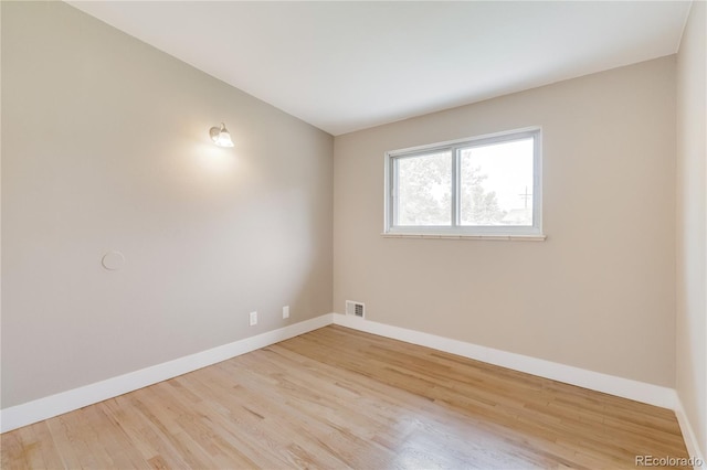 3216 Revere St, Aurora, CO 80011 - empty room with wood finished floors and baseboards