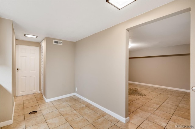 3216 Revere St, Aurora, CO 80011 - spare room with light tile patterned floors and baseboards