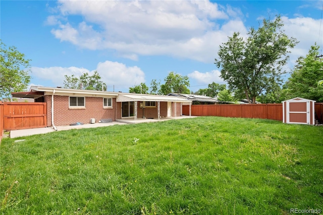 3216 Revere St, Aurora, CO 80011 - back of property featuring a patio area and brick siding
