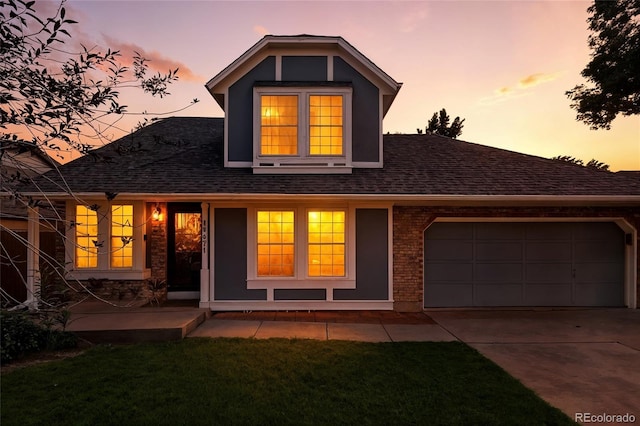13651 W 65th Ave, Arvada, CO 80004 - view of front of property featuring a shingled roof, driveway, an attached garage, and a front lawn